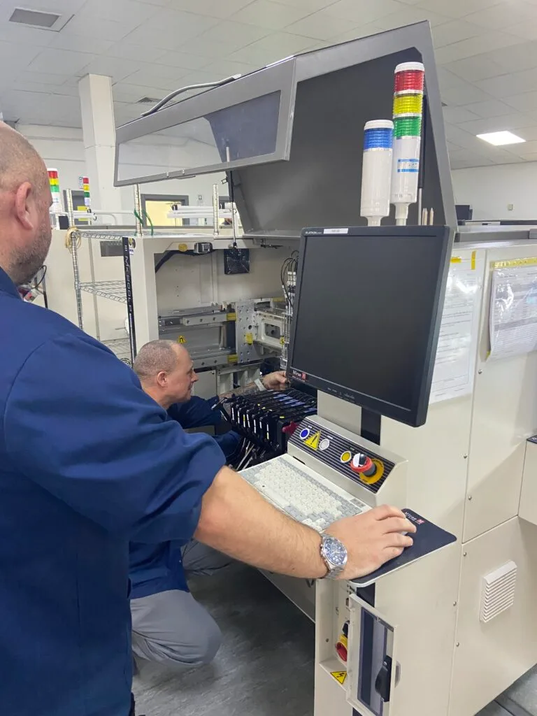 Engineer carrying out maintenance on production equipment