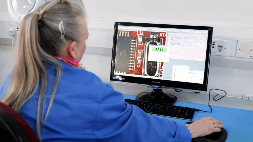 Operator reviewing an assembly at a J-TEQ inspection workstation