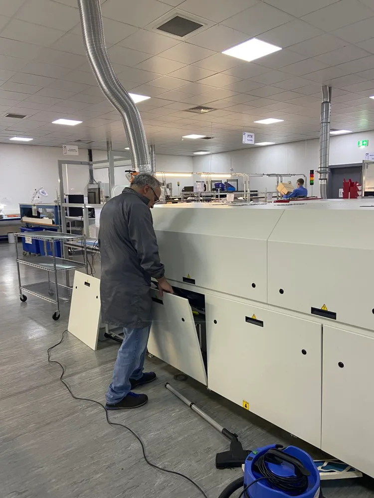Engineer working on a machine during planned maintenance