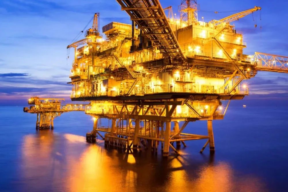 Offshore oil platform at sunset