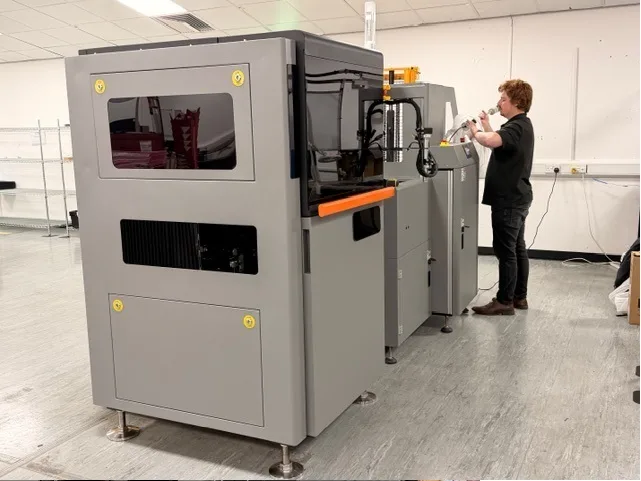 Operator running the Prey Falcon inline AOI system
