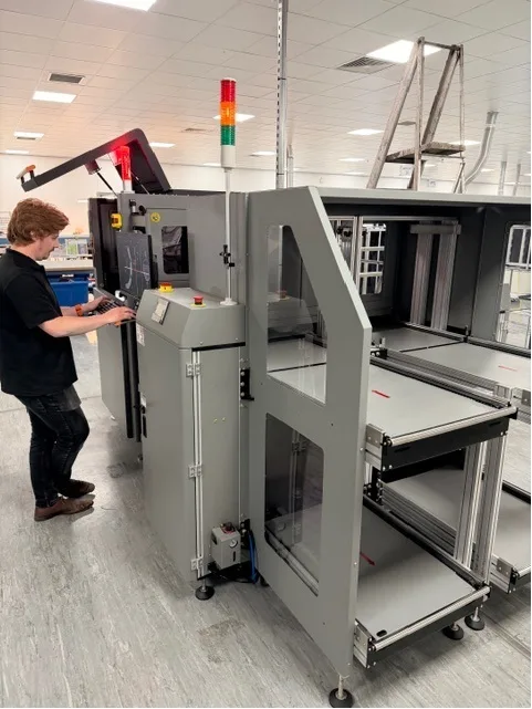 J-TEQ engineer operating the inline AOI system